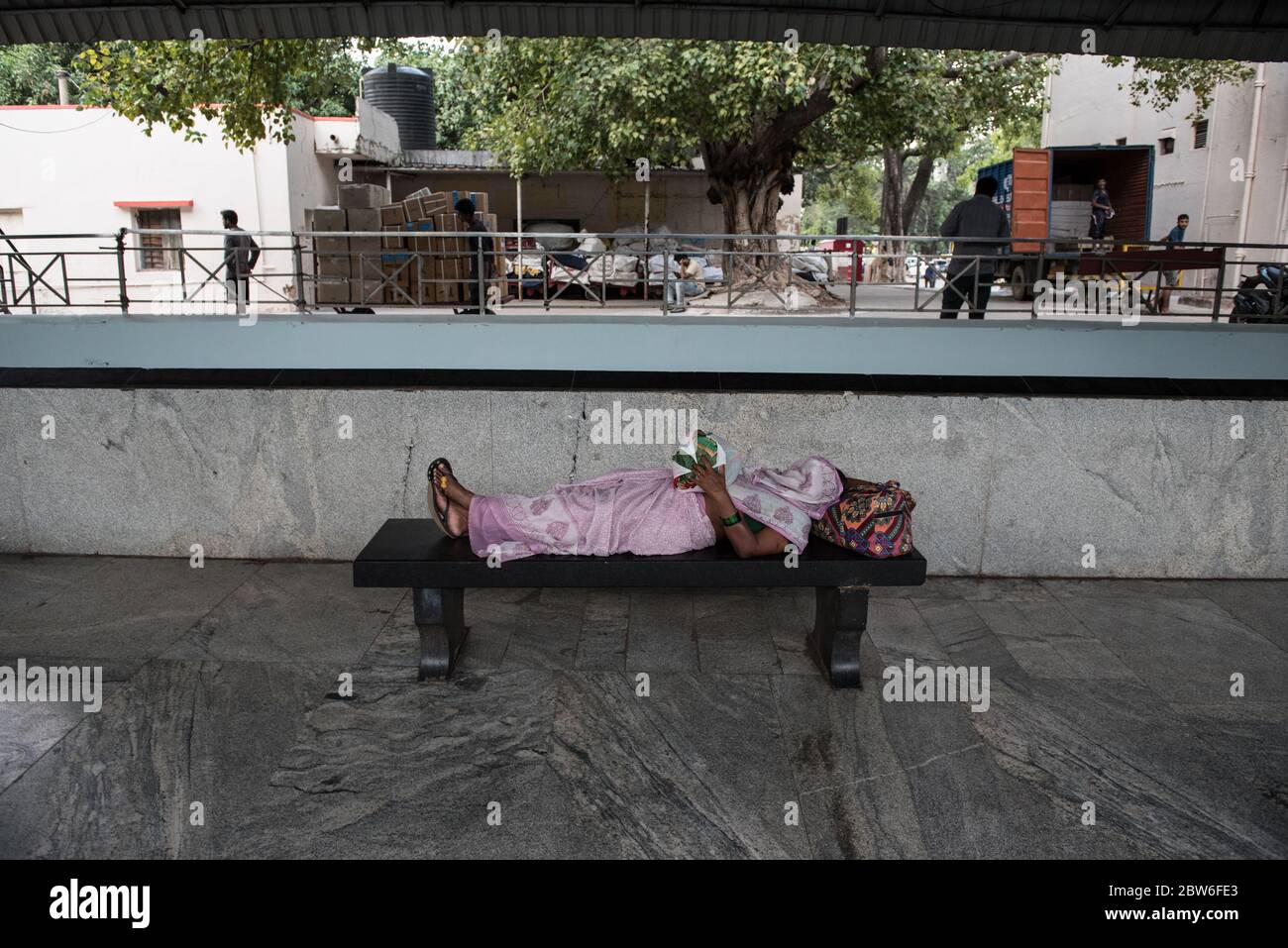 Passengers sleeping on floor of train station, India. Indian Railways. Rail Travel. Migrants. Stock Photo