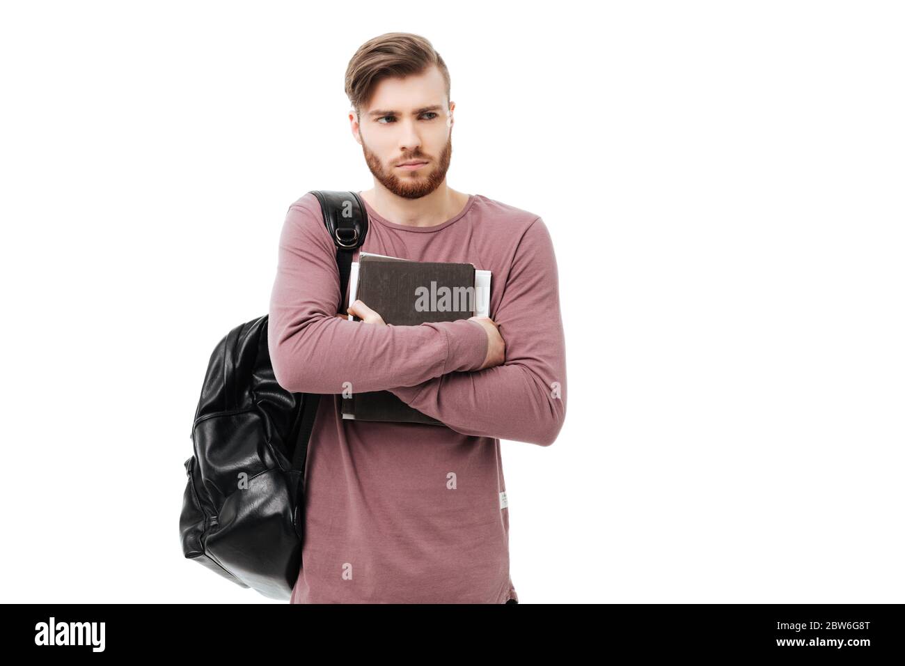 Upset student guy with books carrying a backpack isolated Stock Photo ...