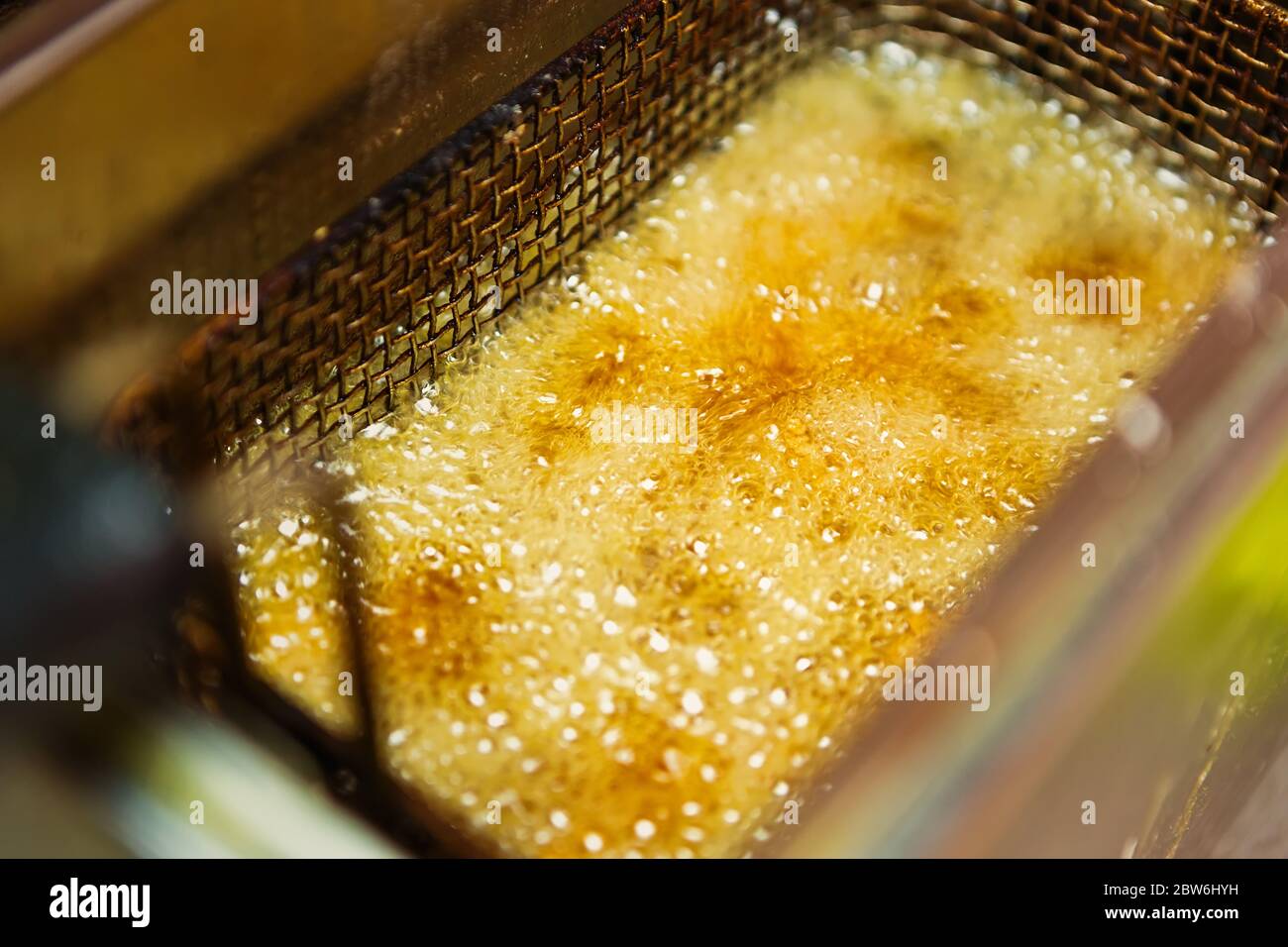 French fries frying in hot oil.Fast food restaurant kitchen cooking