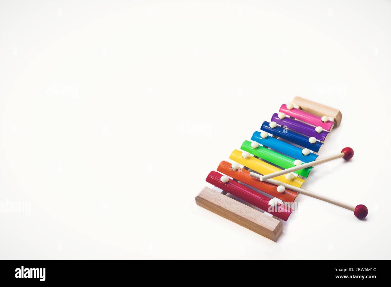 Rainbow Colored Wooden Toy 8 tone Xylophone glockenspiel isolated on white background with