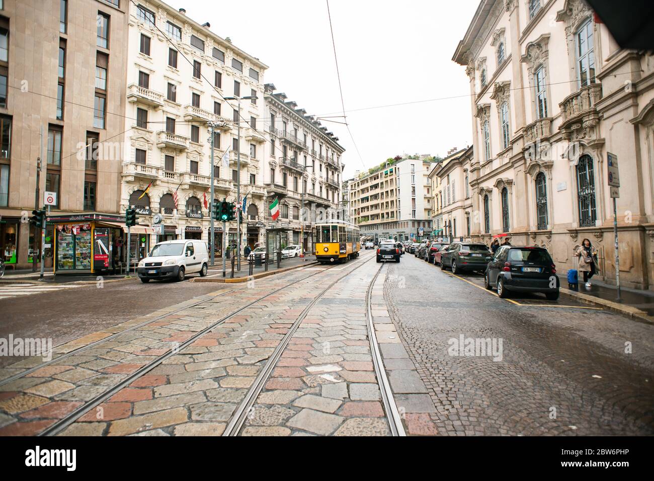 Milan. Italy - May 20, 2019: Milan's Yellow Tram on Magenta Street. Special Tram Line. Street Panorama after Rain. Stock Photo