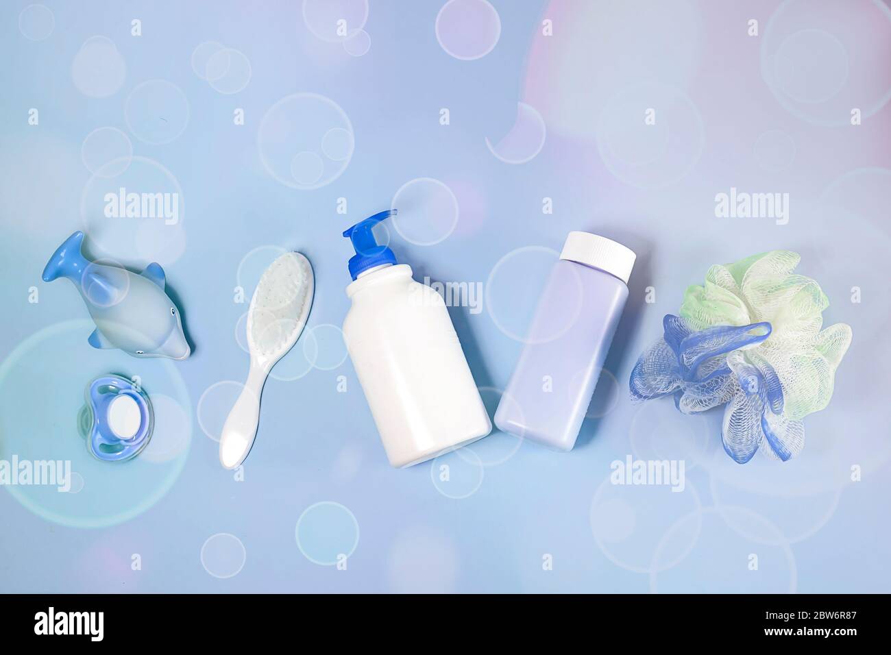 Bath products flat lay. top view of children's bathing things shampoo