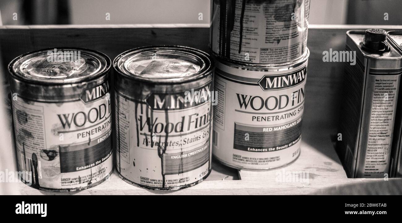 Cans of Used Paint & Stain for a Home Renovation Project Stock Photo