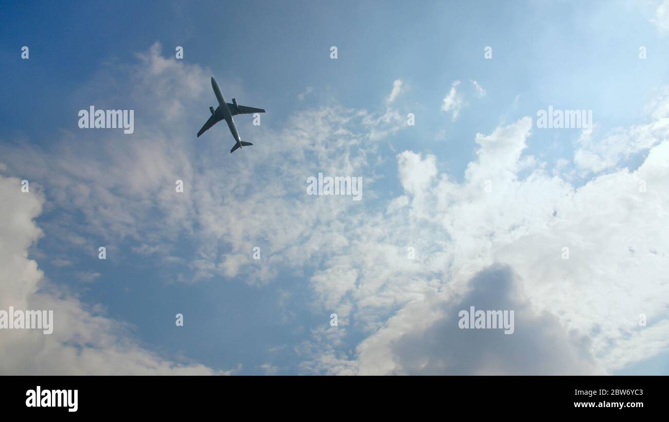 Passenger airplane takes off against the blue sky with clouds Stock ...
