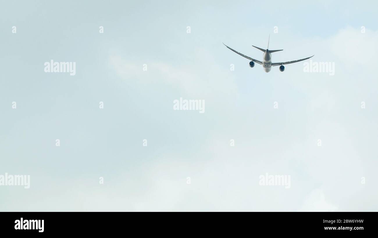 Passenger airplane takes off against the blue sky with clouds Stock ...