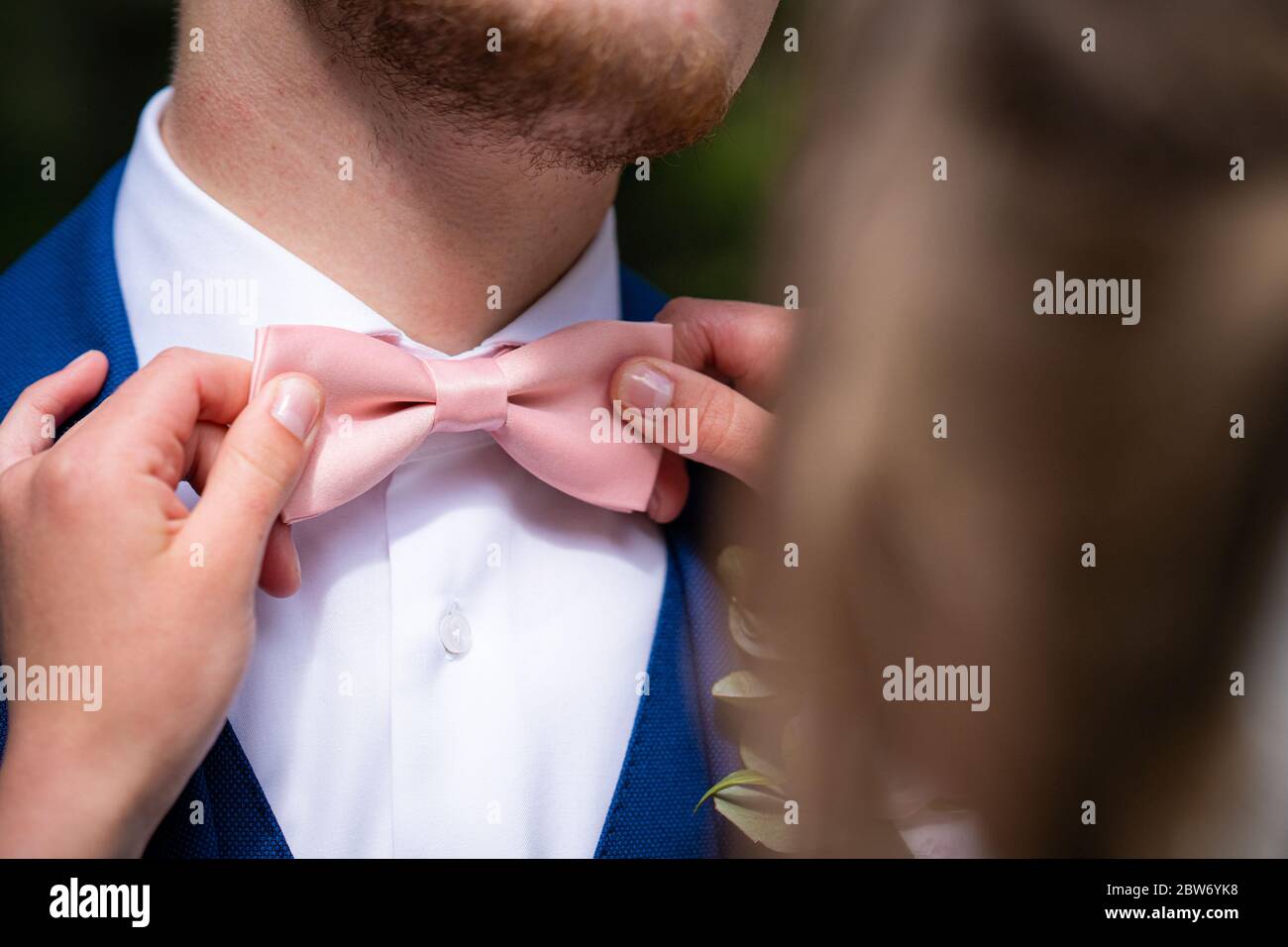 Grooms in Navy Suits and Bow Ties