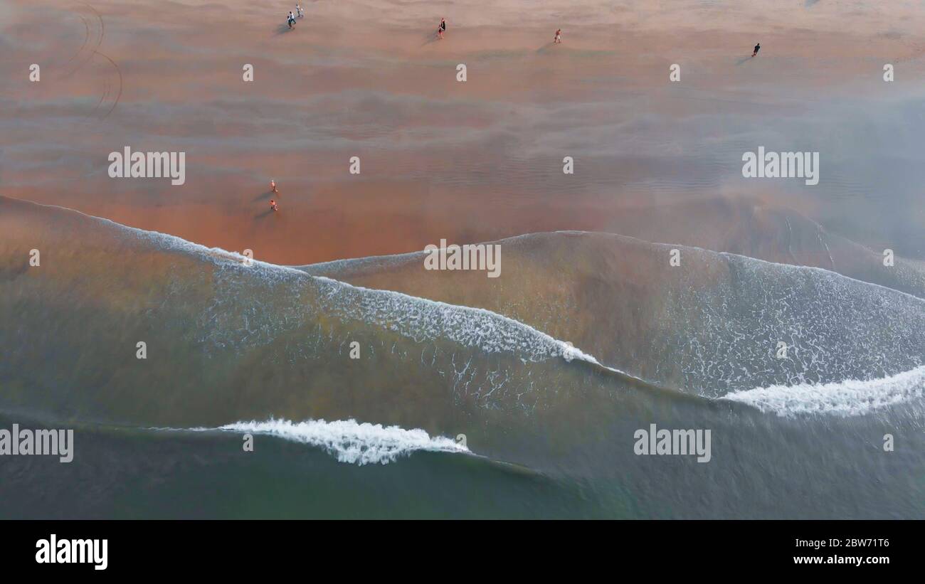 Shooting from the drone of the Arambol beach with tidal waves. Goa State. India. Stock Photo
