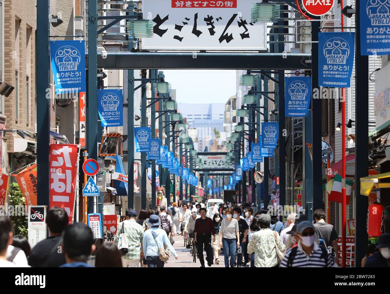 Tokyo, Japan. 30th May, 2020. People stroll at a shopping street in Tokyo on Saturday, May 30, 2020. Japanese government lifted a state of emergency for the outbreak of the new coronavirus this week and people returned to business. Credit: Yoshio Tsunoda/AFLO/Alamy Live News Stock Photo