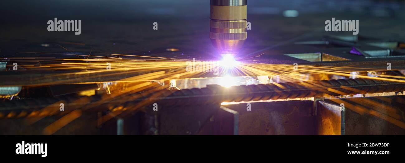 Plasma cutting machine cuts metal material with sparks Stock Photo