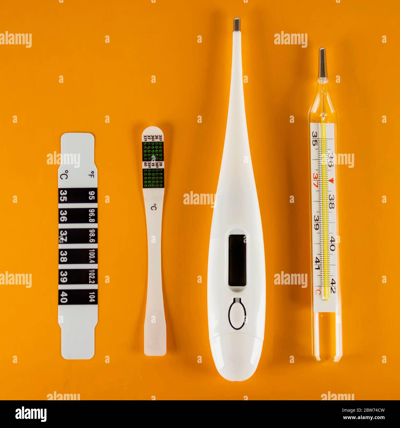 https://c8.alamy.com/comp/2BW74CW/on-a-yellow-background-there-are-four-types-of-thermometers-liquid-crystal-clinical-electric-and-mercury-concept-of-health-care-and-medicine-2BW74CW.jpg