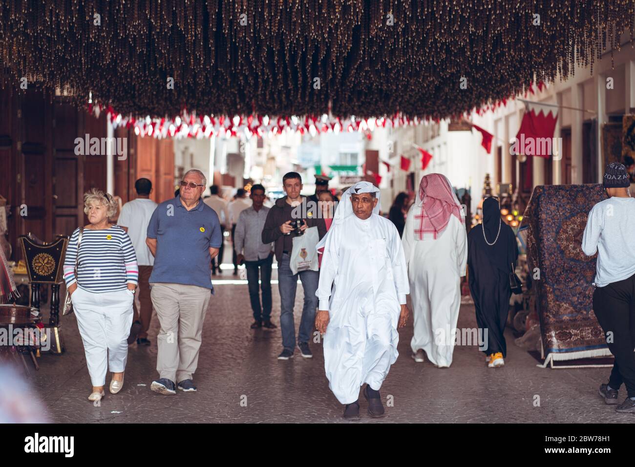 Bahrain city / Bahrain - January 15, 2020: Local Muslim people shopping in souq bazaar area in old town downtown Bahrain Stock Photo