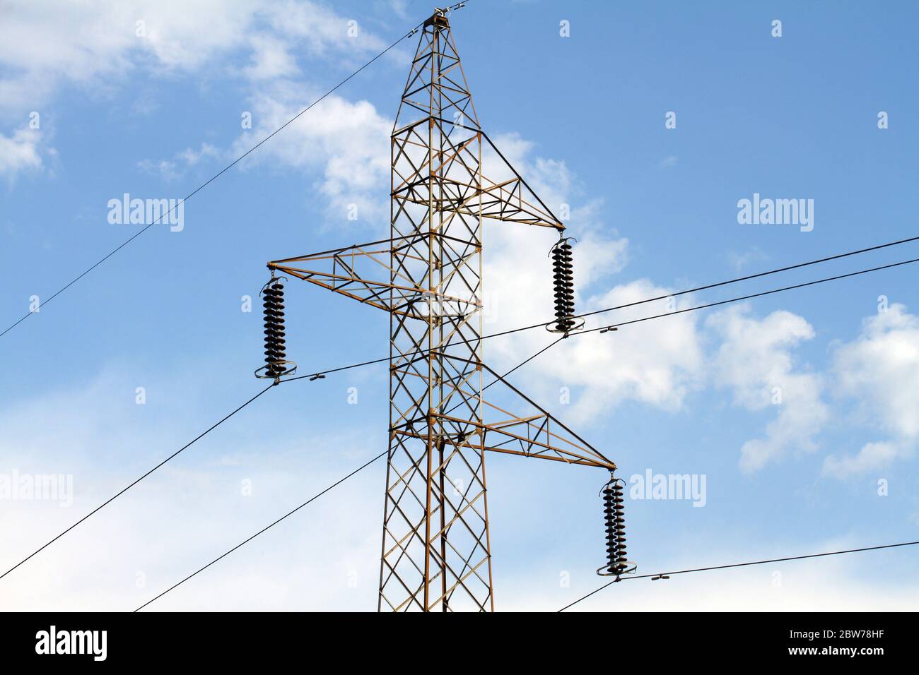 Power lines transmission line blue sky with clouds Stock Photo - Alamy