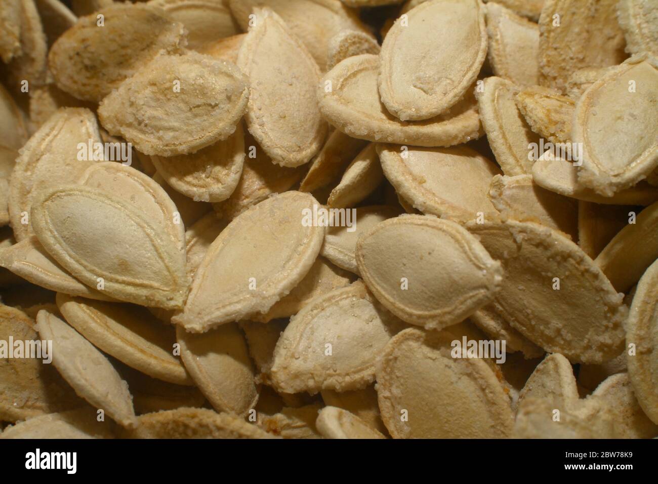 Roasted salty pumpkin seeds hi-res stock photography and images - Alamy