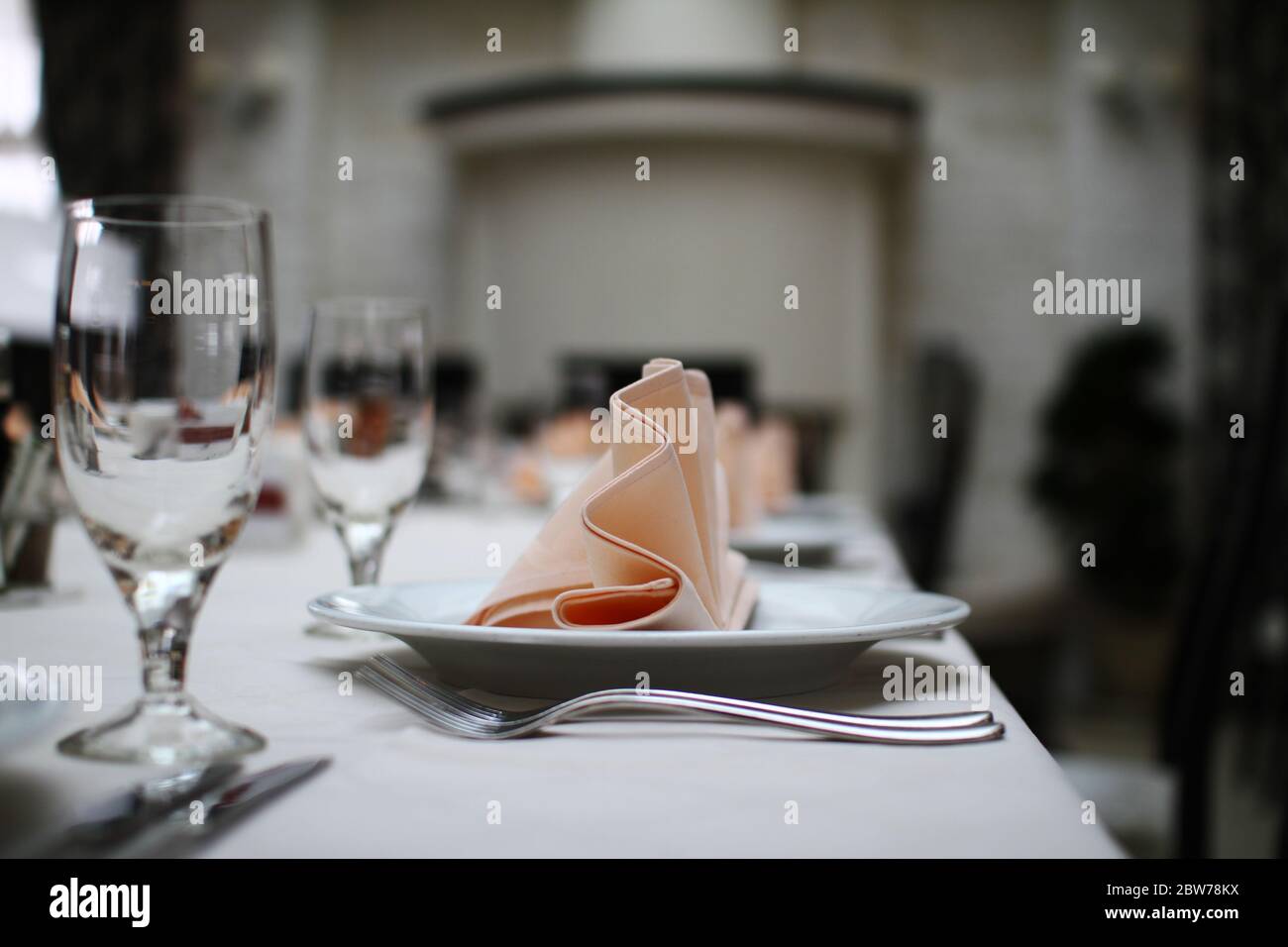 table set in a restaurant, cups and plates Stock Photo Alamy