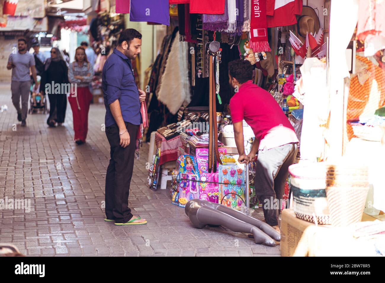 Bahrain city / Bahrain - January 15, 2020: Local Muslim people shopping in souq bazaar area in old town downtown Bahrain Stock Photo