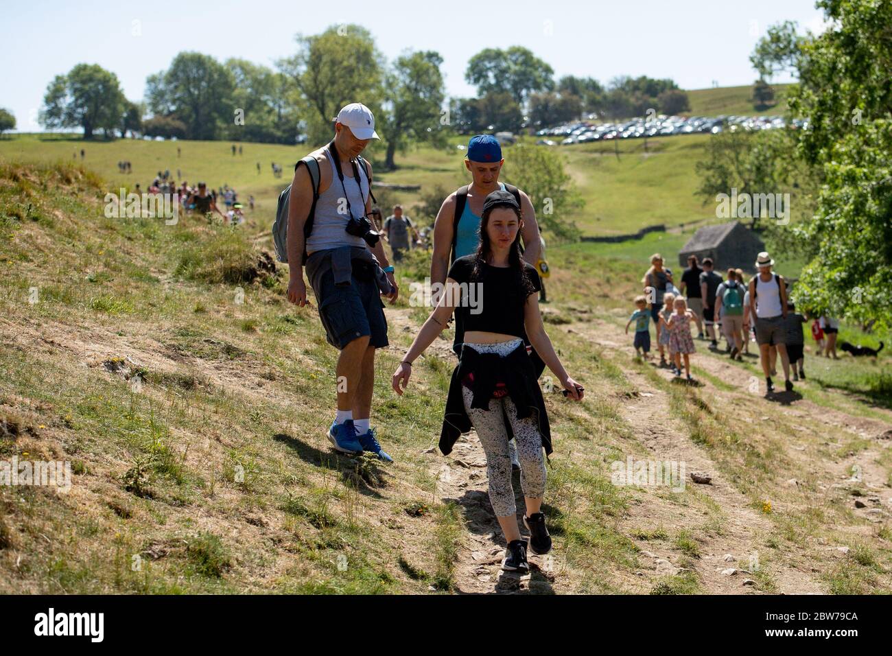 People enjoying the good weather in Dovedale in the Peak District, as the public are being reminded to practice social distancing following the relaxation of lockdown restrictions. Stock Photo