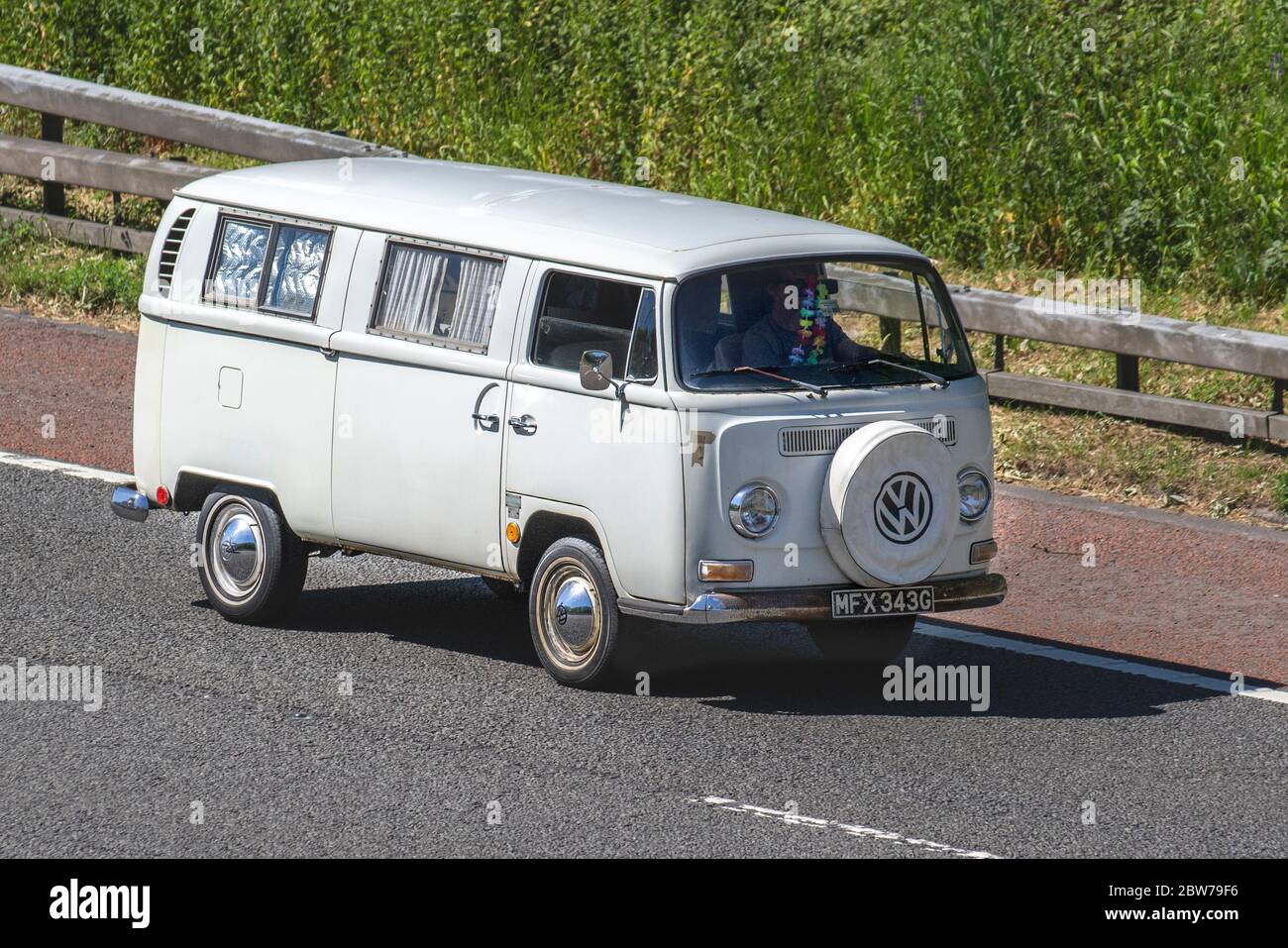 1969 60s Cream VW Transporter; Touring Caravans and Motorhomes, campervans on Britain's roads, RV leisure vehicle, family holidays, caravanette vacations, caravan holiday, van conversions, autohome, life on the road Stock Photo