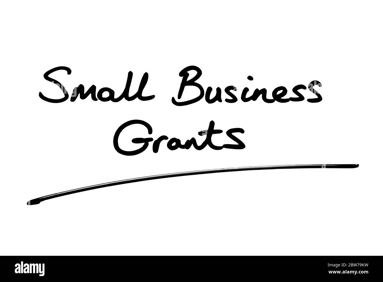 Small Business Grants handwritten on a white background. Stock Photo