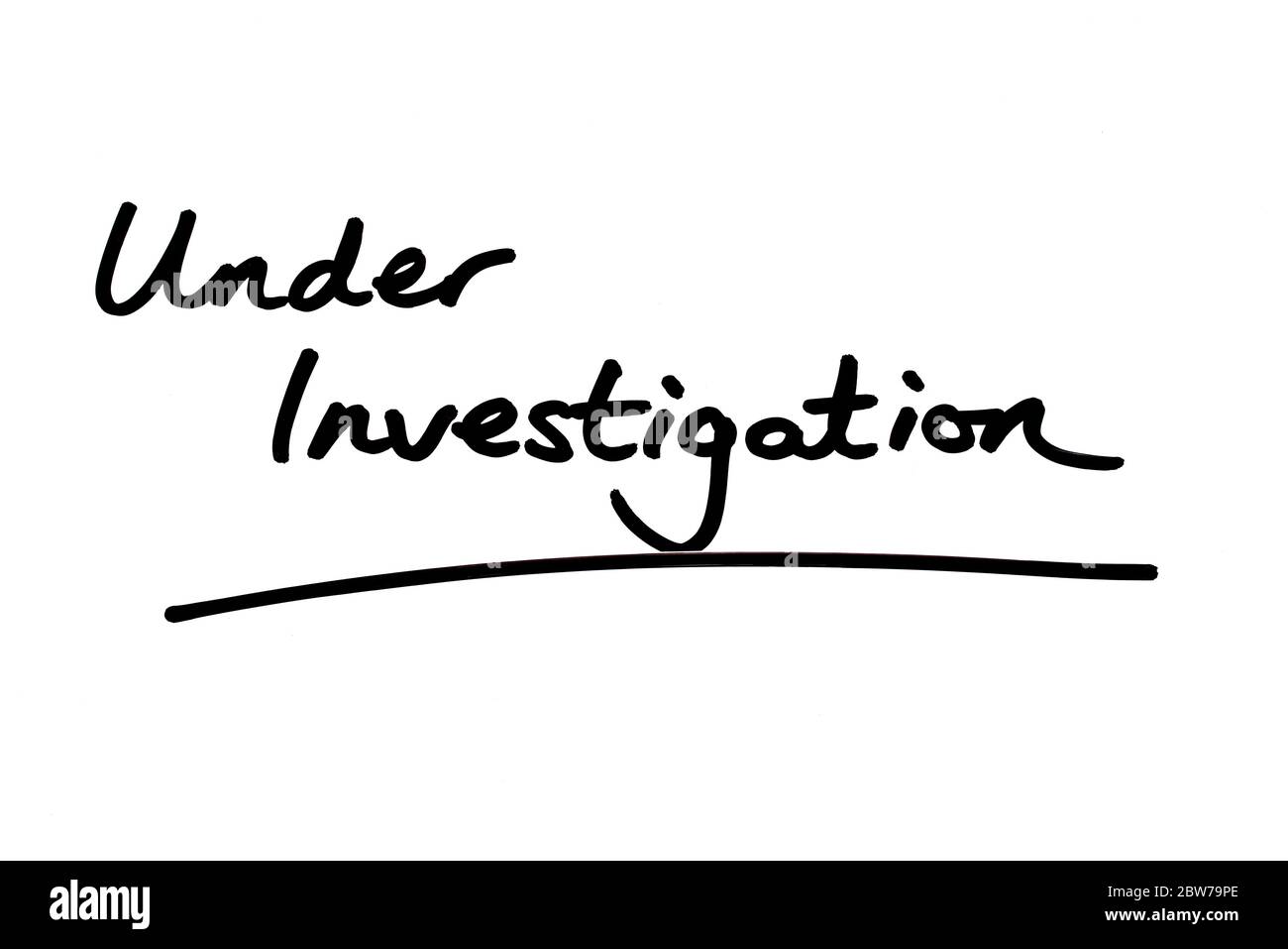 Under Investigation handwritten on a white background. Stock Photo
