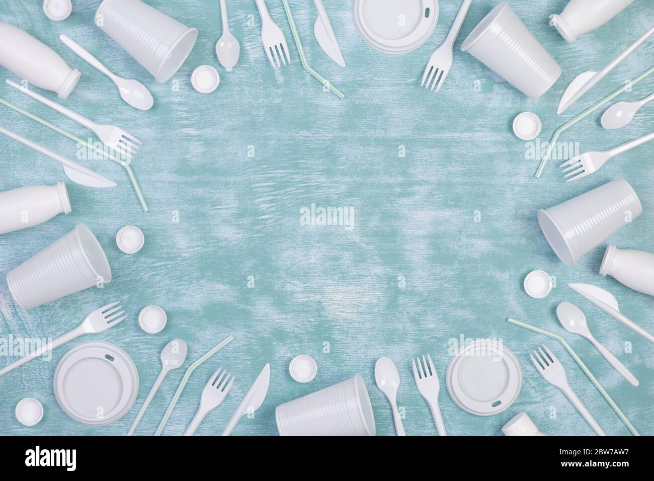 https://c8.alamy.com/comp/2BW7AW7/disposable-white-single-use-plastic-objects-such-as-bottles-cups-forks-and-spoons-on-blue-background-2BW7AW7.jpg