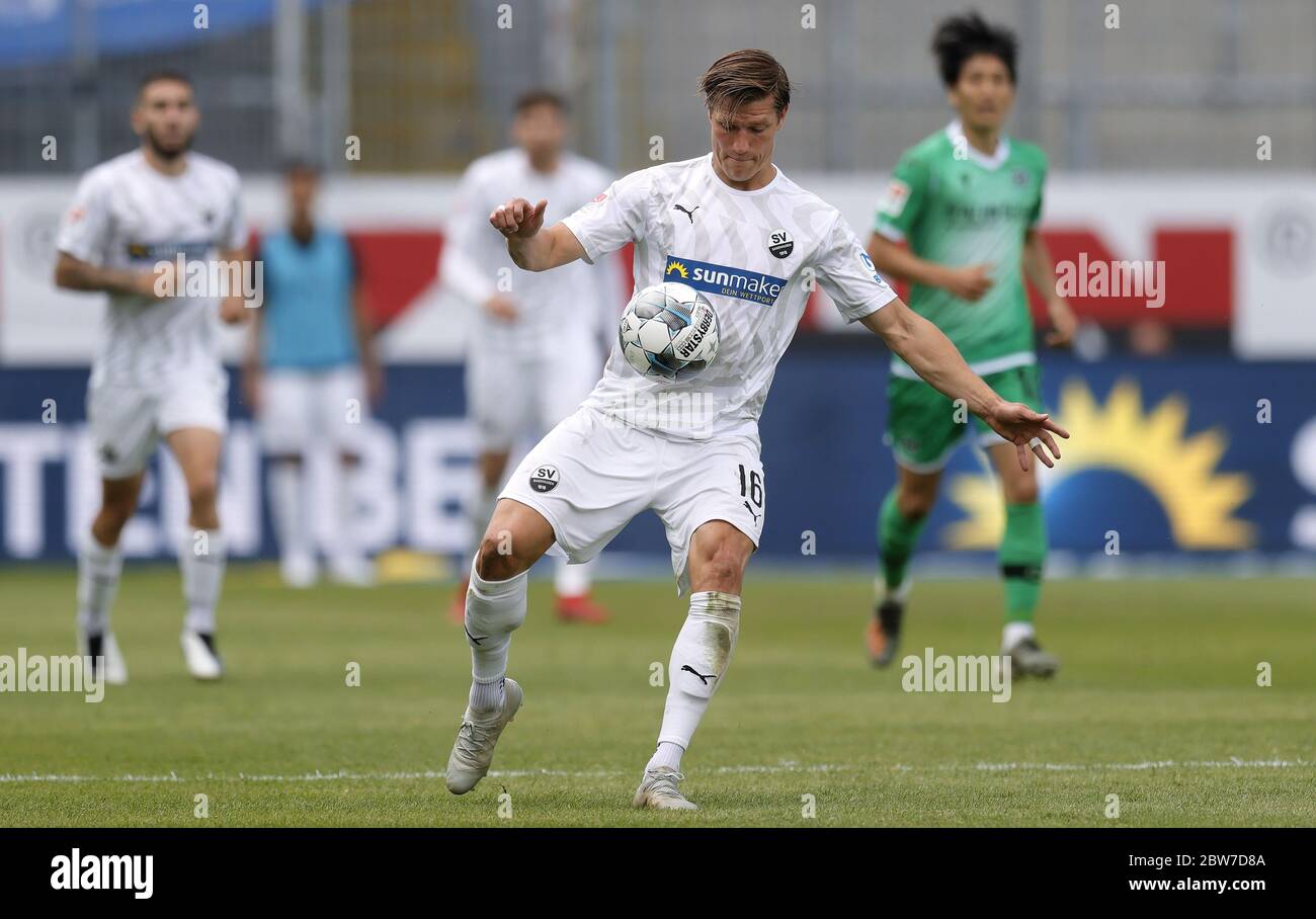 Sandhausen, Germany. 30th May, 2020. Football: 2nd Bundesliga, SV Sandhausen - Hannover 96: Sandhausens Kevin Behrens plays the ball. Credit: Ronald Wittek/epa/Pool/dpa - IMPORTANT NOTE: In accordance with the regulations of the DFL Deutsche Fußball Liga and the DFB Deutscher Fußball-Bund, it is prohibited to exploit or have exploited in the stadium and/or from the game taken photographs in the form of sequence images and/or video-like photo series./dpa/Alamy Live News Stock Photo