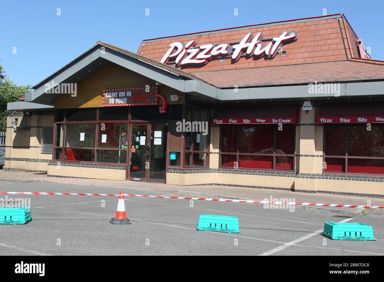 A coned-off area in the car park at Pizza Hut in Galleys Corner, Braintree. The restaurant remains closed during the COVID-19 pandemic and lockdown. Stock Photo