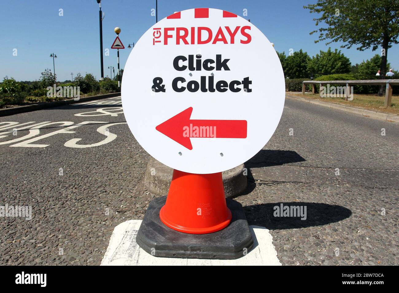 Signs give instructions for Click & Collect customers at TGI Fridays restaurant in the Braintree Village shopping outlet during the COVID-19 pandemic Stock Photo