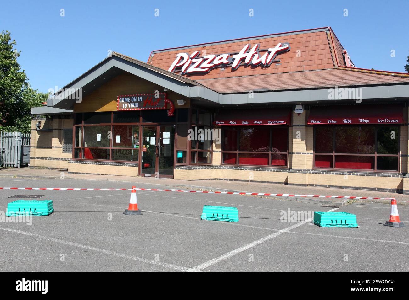 A coned-off area in the car park at Pizza Hut in Galleys Corner, Braintree. The restaurant remains closed during the COVID-19 pandemic and lockdown. Stock Photo