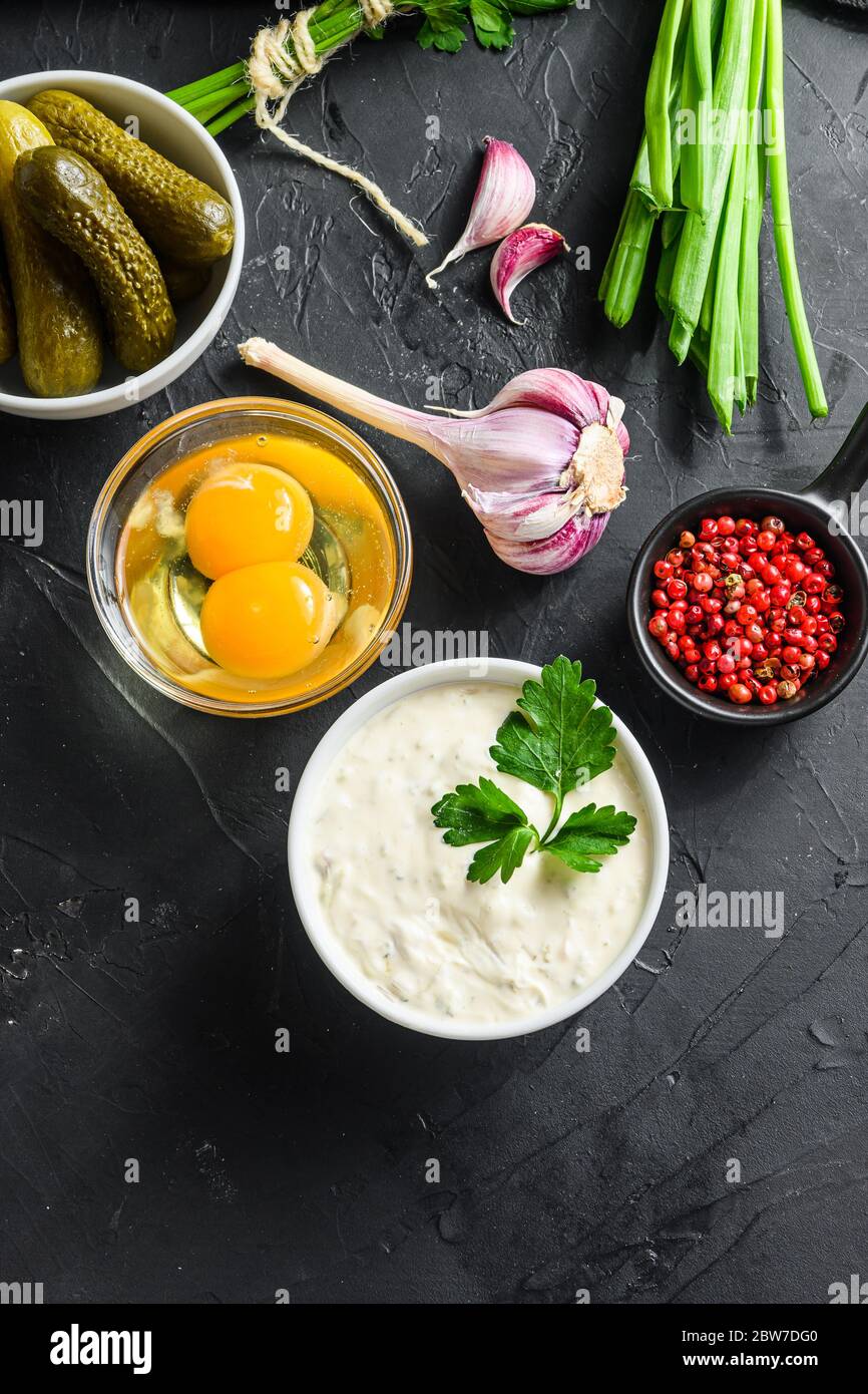 Homemade white sauce tartar tartare with ingredients pickles, capers