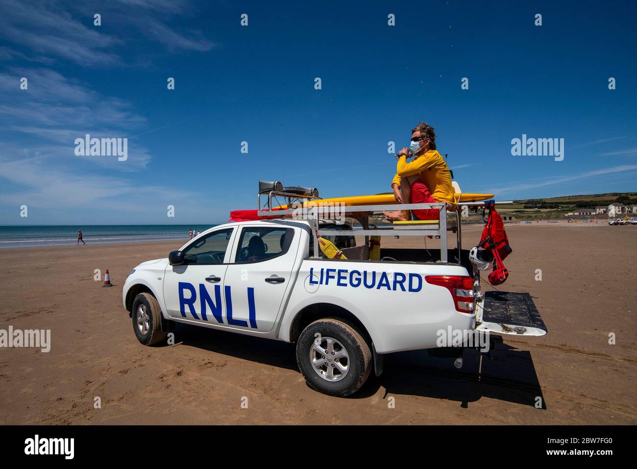 RNLI Lifeguards resume patrols on the beach at Croyde in Devon wearing PPE as ahead of the easing of coronavirus lockdown restriction on Monday. Stock Photo