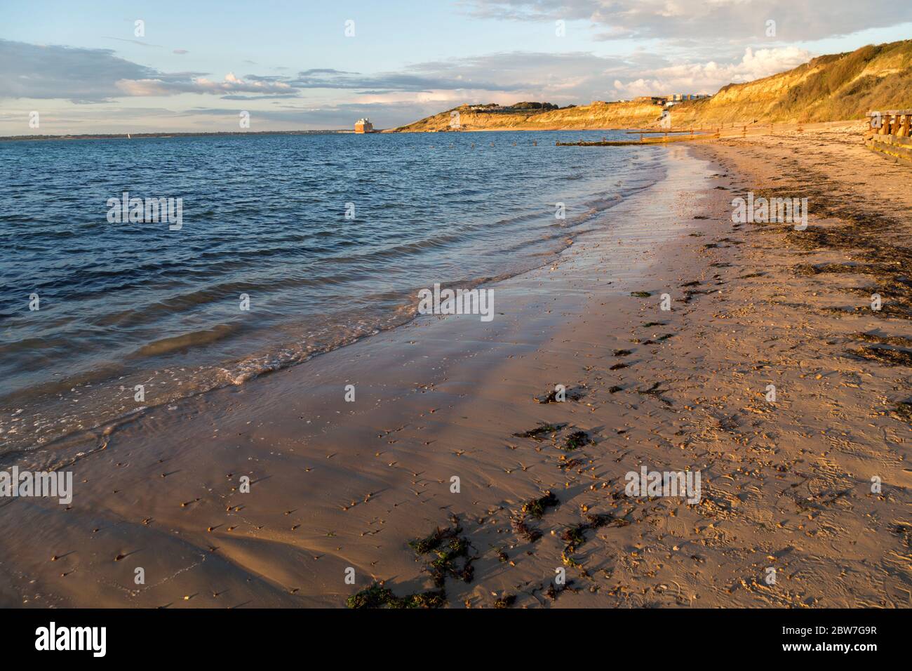 Beach at Colwell Bay with Fort Albert in the distance, Isle of Wight, England, UK Stock Photo