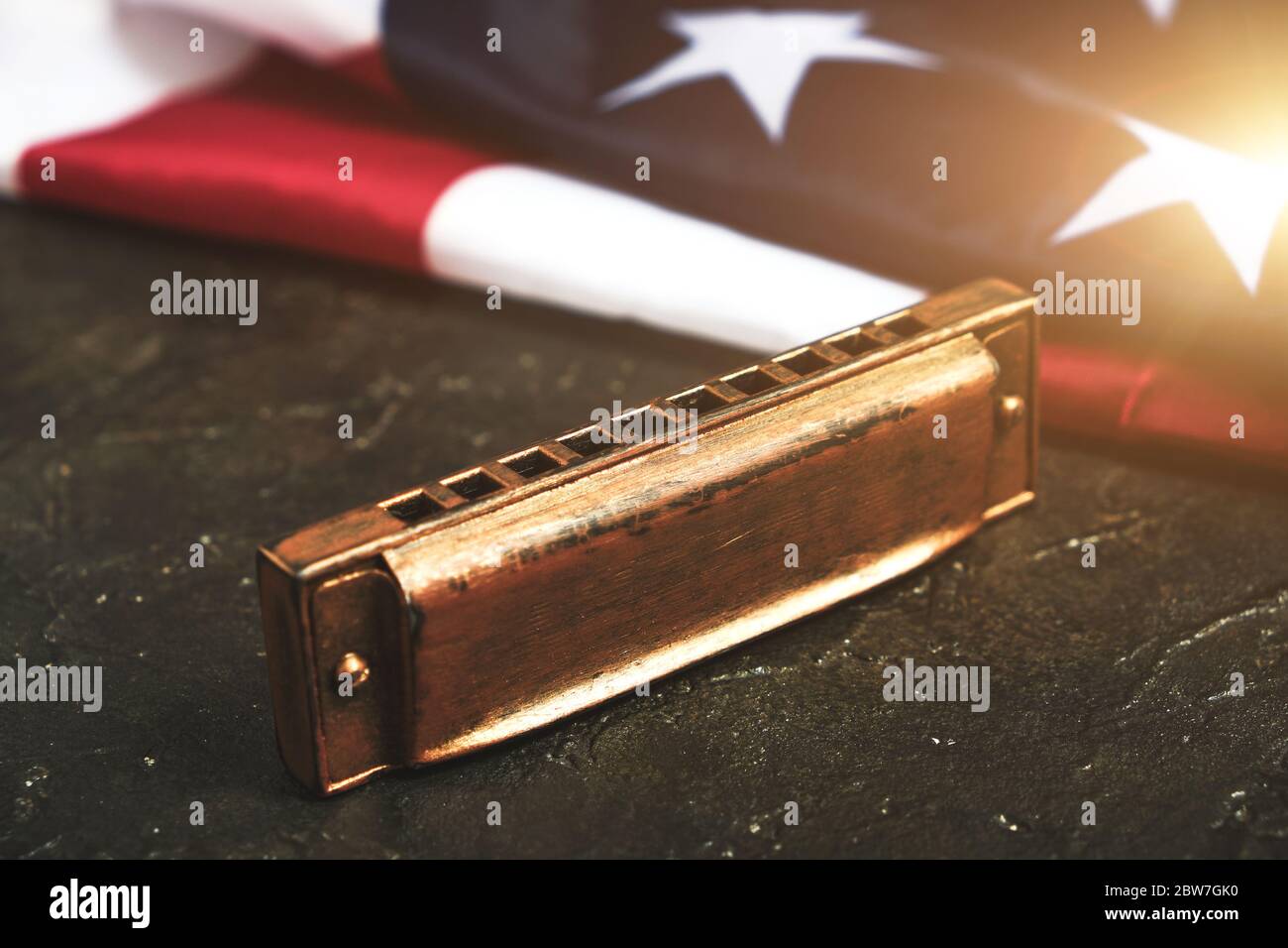 Premium Photo | Harmonica on the background of the flag of the united  states of america. musical instrument.stars and stripes.