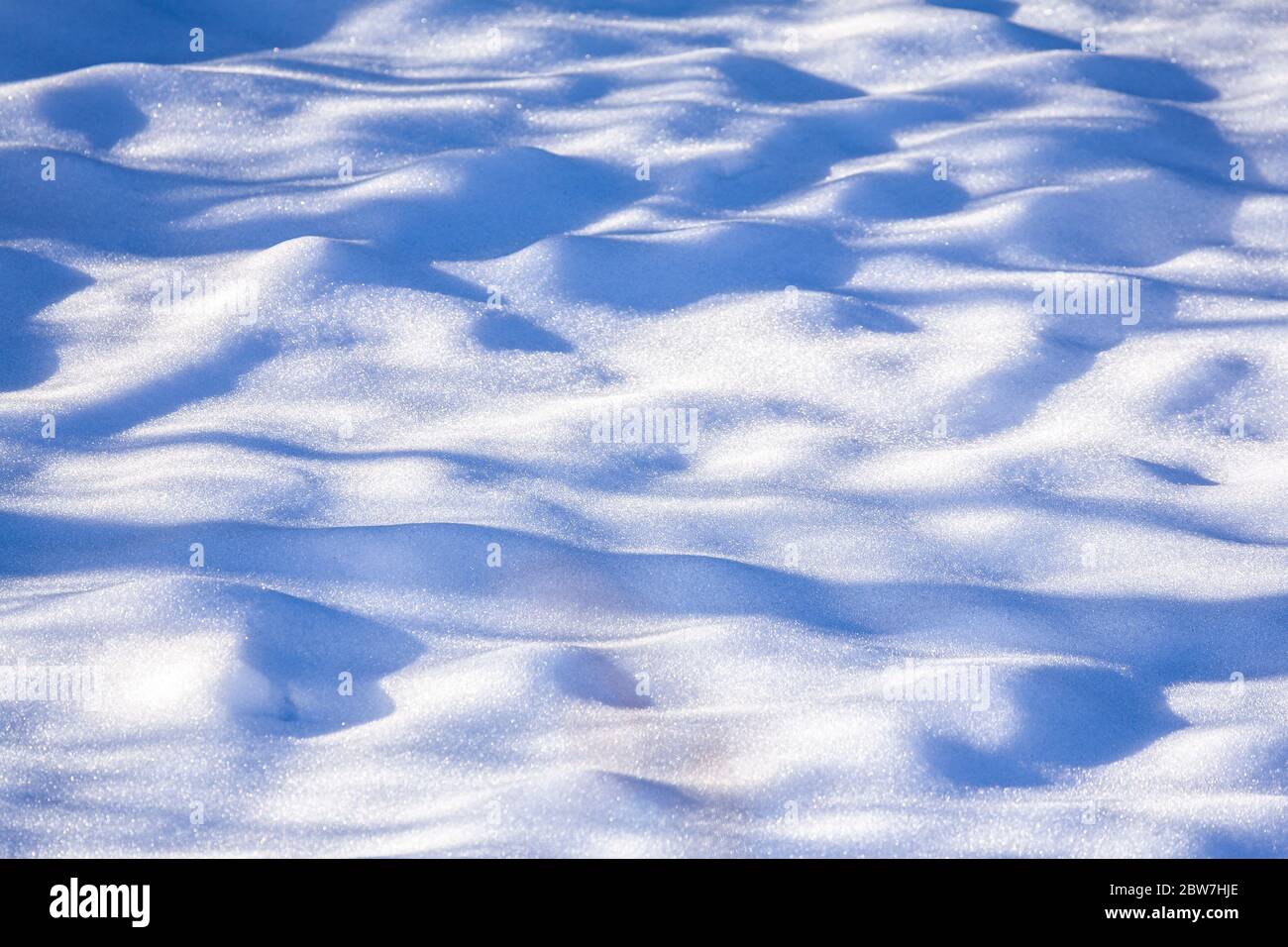 Sunlight and shadow on snow Stock Photo