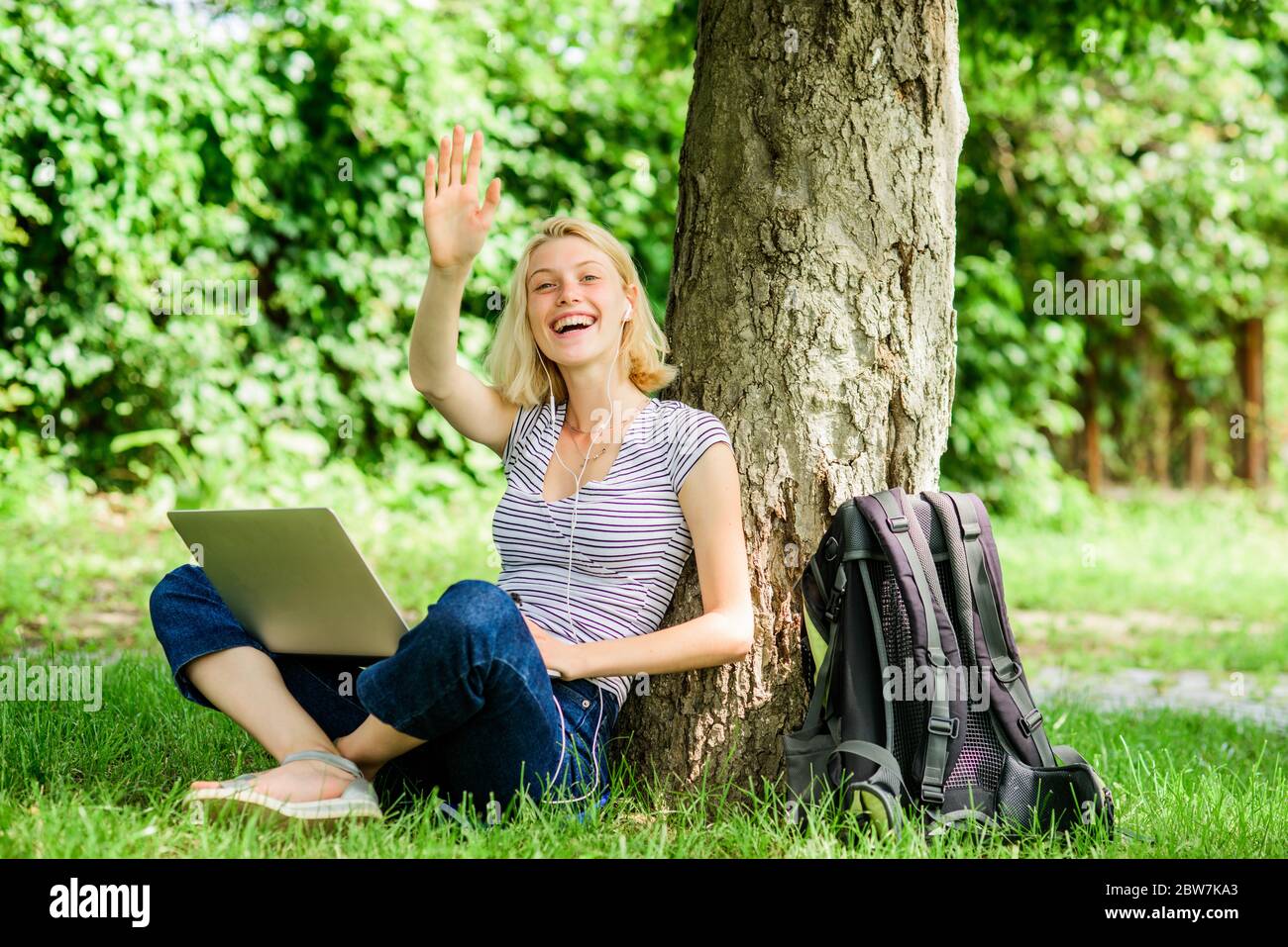 Woman student sit on grass while study. Nature essential wellbeing and ability be productive. Work in summer park. Girl work with laptop in park. Reasons why you should take your work outside. Stock Photo