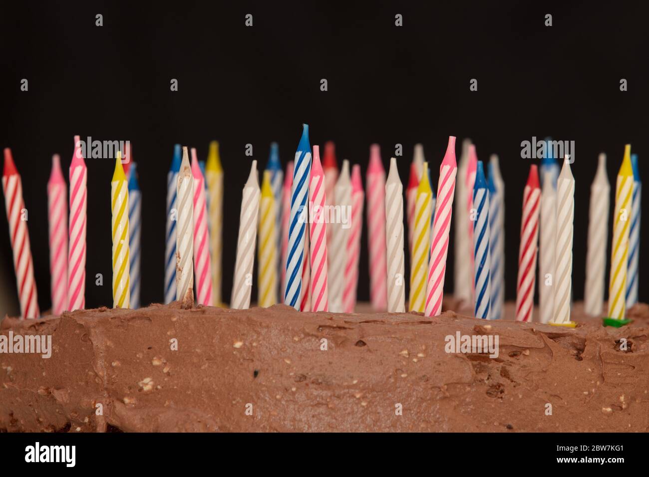 Chocolate Birthday Cake with Candles on dark background Stock Photo - Alamy