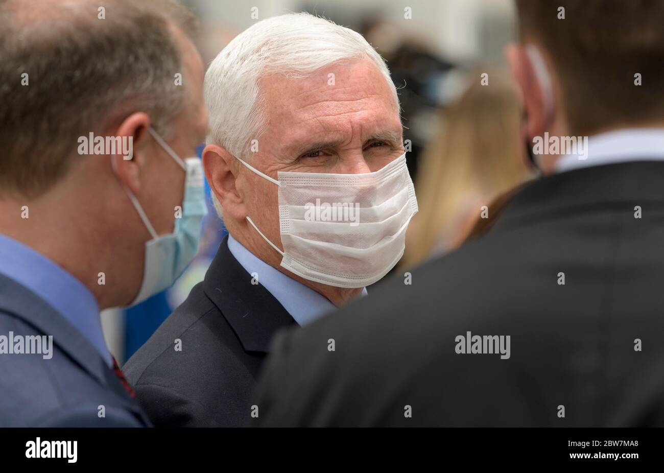 U.S. Vice President Mike Pence talks with NASA Administrator Jim Bridenstine, left, and Elon Musk, SpaceX Chief Engineer as they wait to see NASA astronauts Robert Behnken and Douglas Hurley as they depart for Launch Complex 39A to board a SpaceX Crew Dragon spacecraft for launch, at the Kennedy Space Center May 27, 2020 in Cape Canaveral, Florida. The mission was scrubbed 16 minutes before launch due to weather and will try again on the 30th. Stock Photo