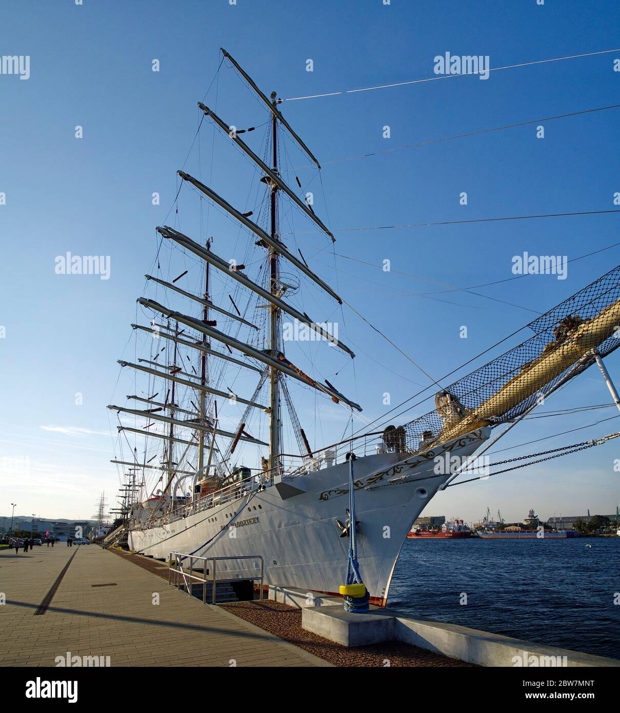 GDYNIA, POLAND: SEPTEMBER 29, 2017: STS Gift of the Youth (Dar Mlodziezy) - three-masted Polish training frigate type B-95 in Gdynia port over Baltic Stock Photo