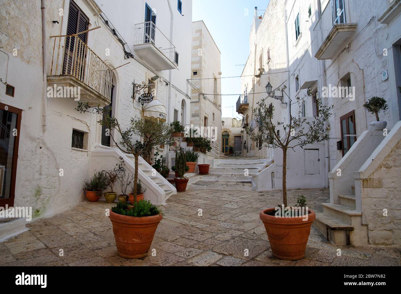 OSTUNI, APULIA, ITALY - MARCH 28th, 2018: Typical street of Ostuni, La Citta Bianca. Ostuni. Apulia, Italy Stock Photo