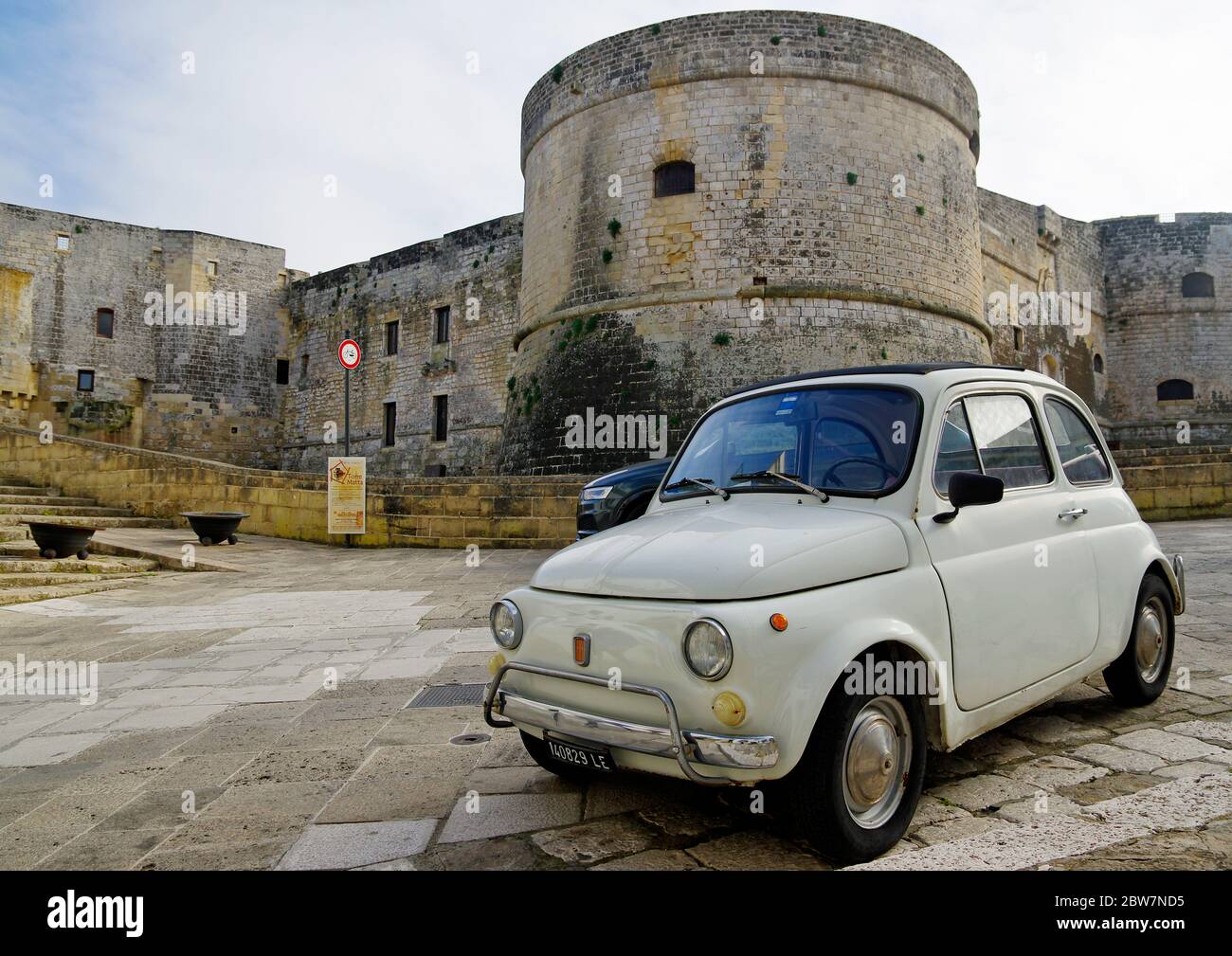 OTRANTO, APULIA ,ITALY - MARCH 30, 2018: Classic Fiat Cinquecento in front of Medieval Aragonese Castle in Otranto, Apulia, Italy Stock Photo