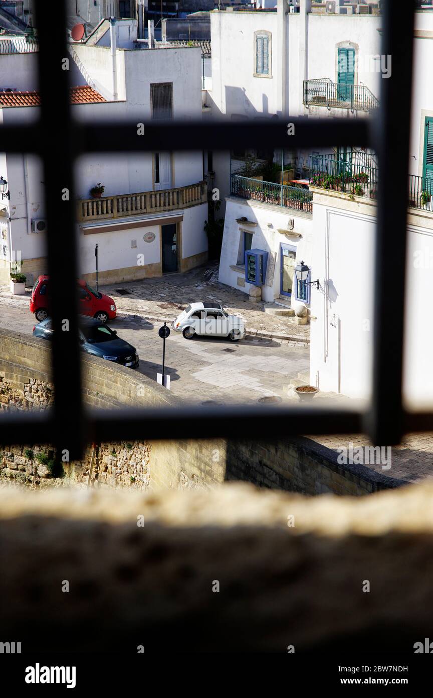 OTRANTO, APULIA ,ITALY - MARCH 30, 2018: Classic Fiat Cinquecento in front of Medieval Aragonese Castle in Otranto, Apulia, Italy Stock Photo