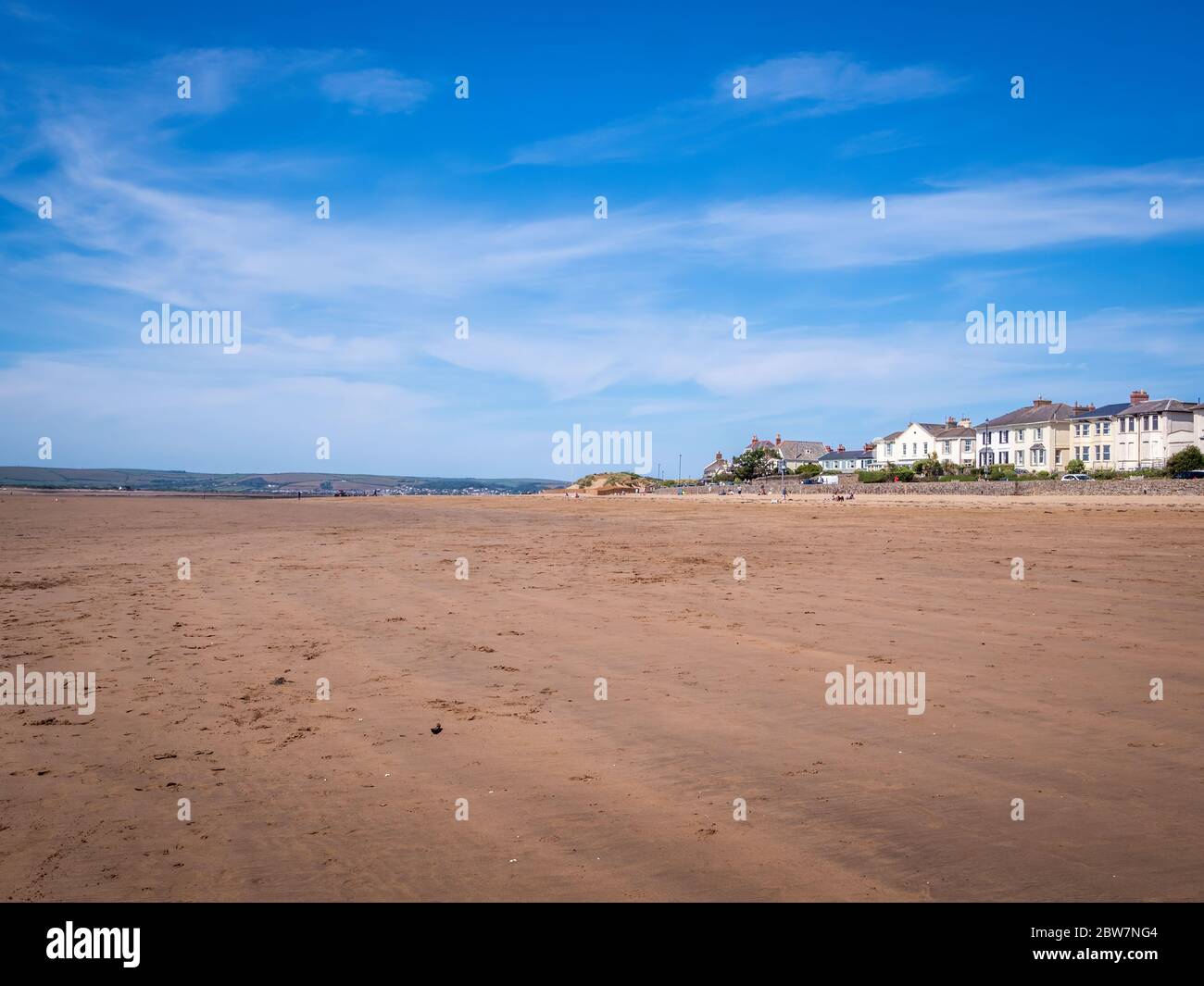 INSTOW, DEVON, UK - MAY 25 2020: Almost deserted sandy beach, Instow, north Devon UK. Few people. Tourism decimated by Coronavirus, Covid lockdown. Stock Photo