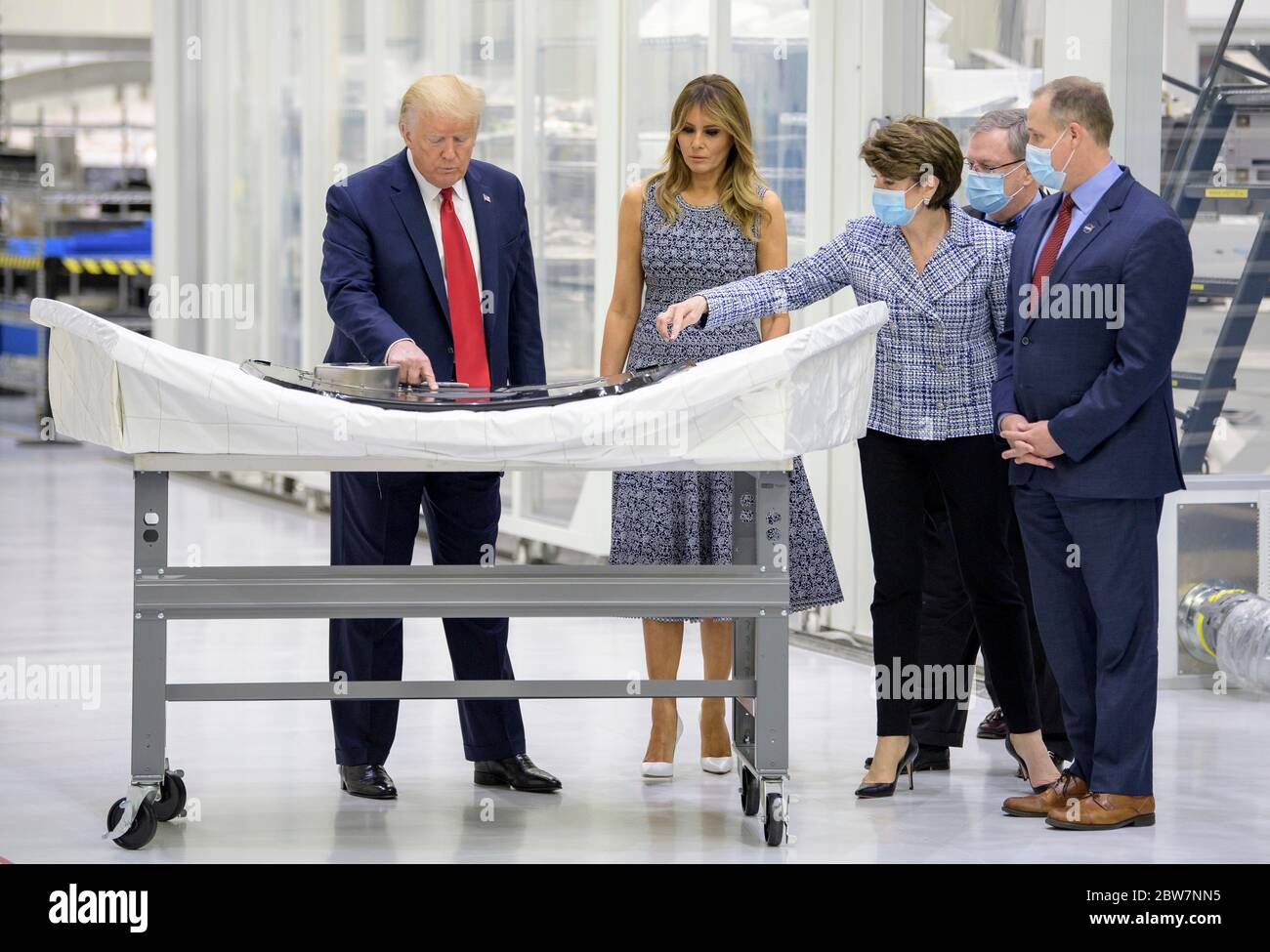 U.S. President Donald Trump signs an Orion capsule hatch that will be used for the Artemis II mission as Vice President Mike Pence, First Lady Melania Trump, and NASA Administrator Jim Bridenstine look on during a tour of the Neil Armstrong Operations and Checkout Building May 27, 2020 in Cape Canaveral, Florida. Stock Photo