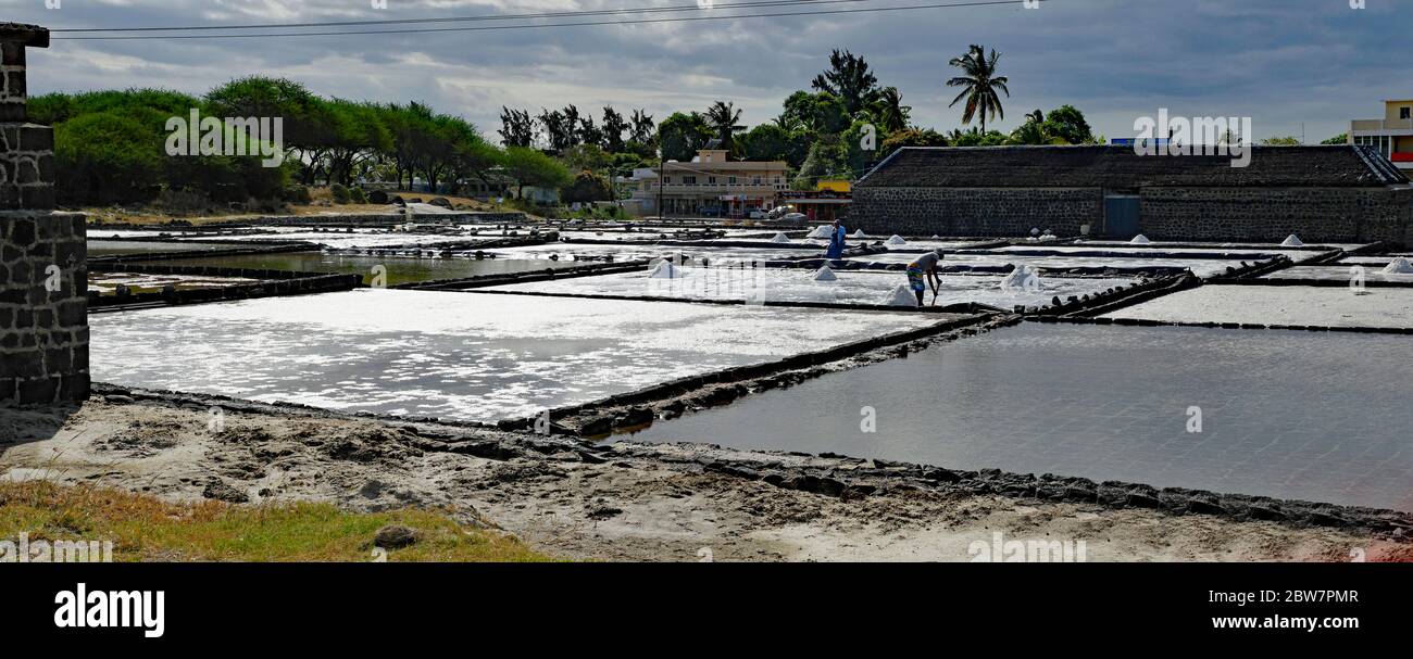 TAMARIN/MAURITIUS - AUGUST 24, 2018: Tamarin Salt Pans is a popular tourist attraction with the square brick clay basins.This place produces artisan s Stock Photo