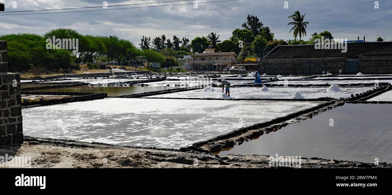 TAMARIN/MAURITIUS - AUGUST 24, 2018: Tamarin Salt Pans is a popular tourist attraction with the square brick clay basins.This place produces artisan s Stock Photo