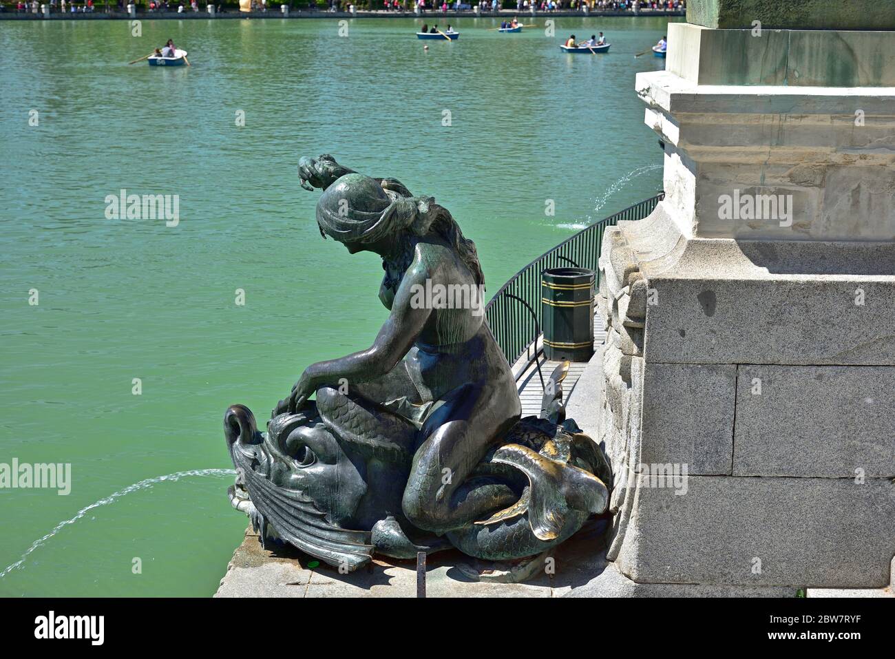 One of many of statue guarding the Monument to Alfonso XII in Jardines del Buen Retiro, the main parc of the city of Madrid, capital of Spain. Stock Photo