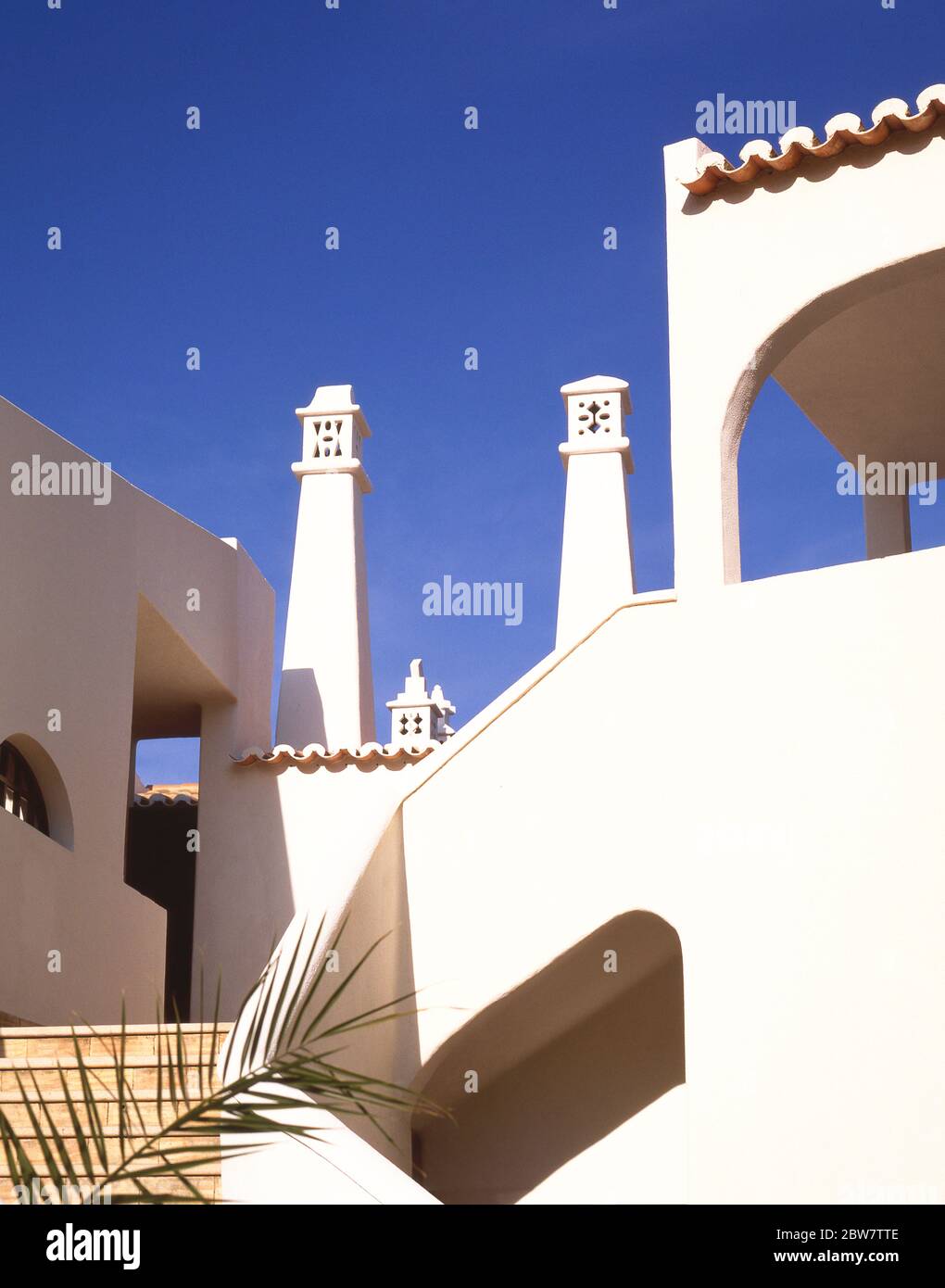 Portuguese villa with characteristic chimneys, near Albufeira, Algarve Region, Portugal Stock Photo