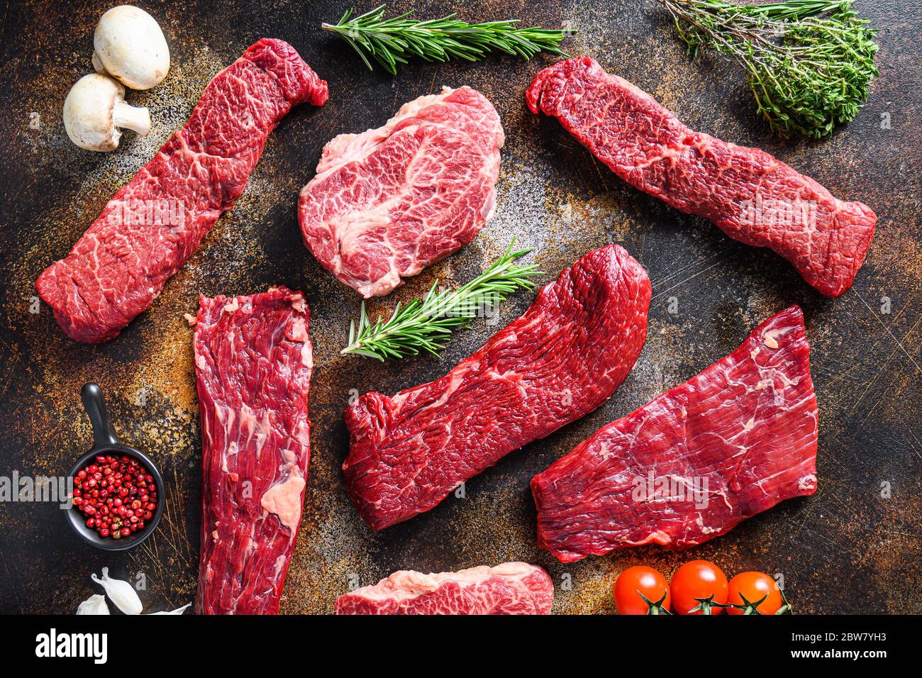 Organic set of raw alternative beef steaks flap flank Steak, machete steak or skirt cut, Top