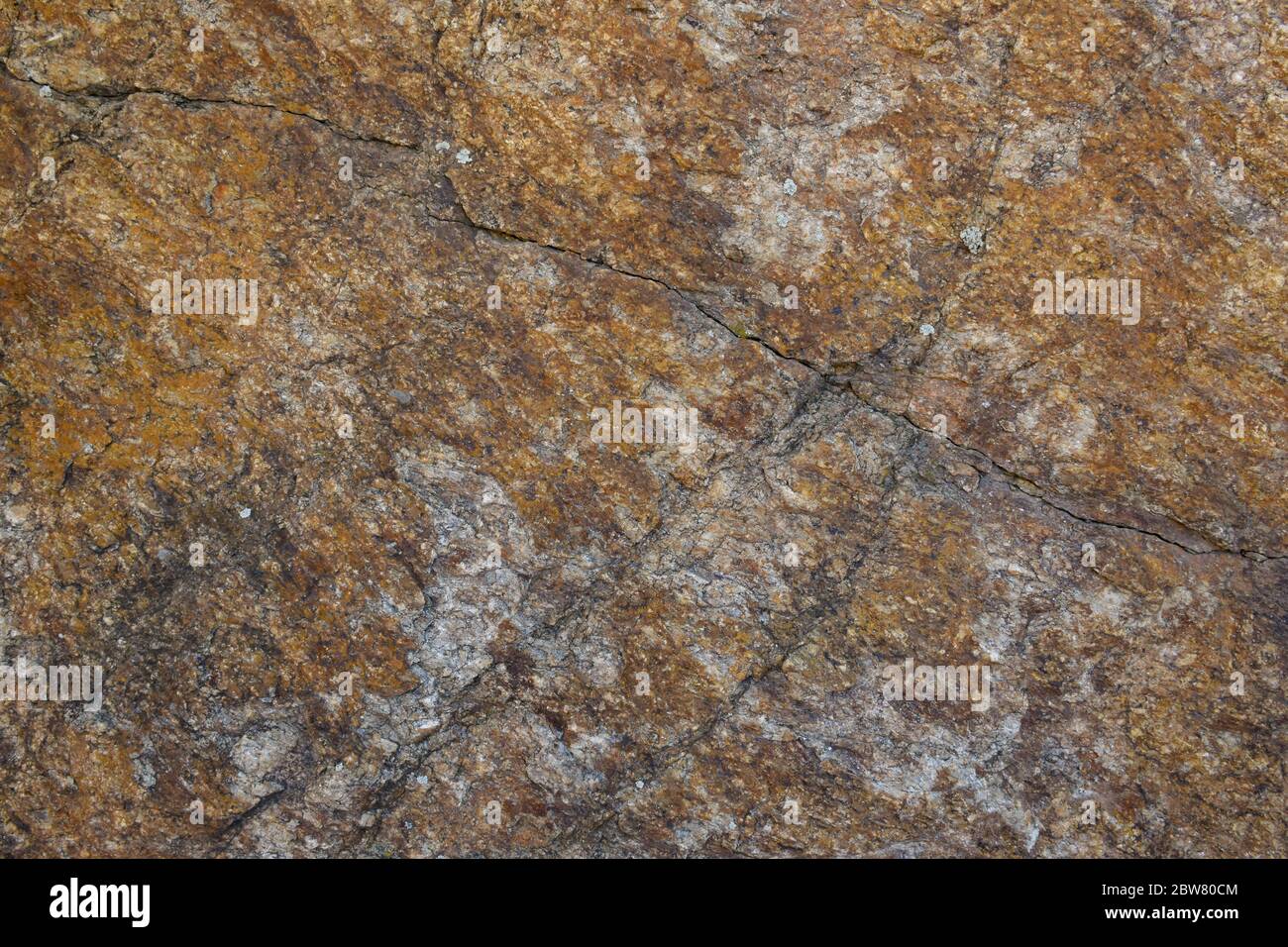 Texture of natural stone. A grey granite stone with cracks and rusty stains Stock Photo Alamy