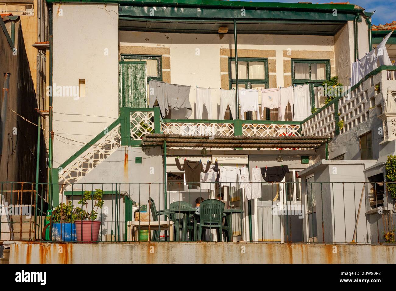 Clothes drying outside on the balcony of a house in Porto, Portugal