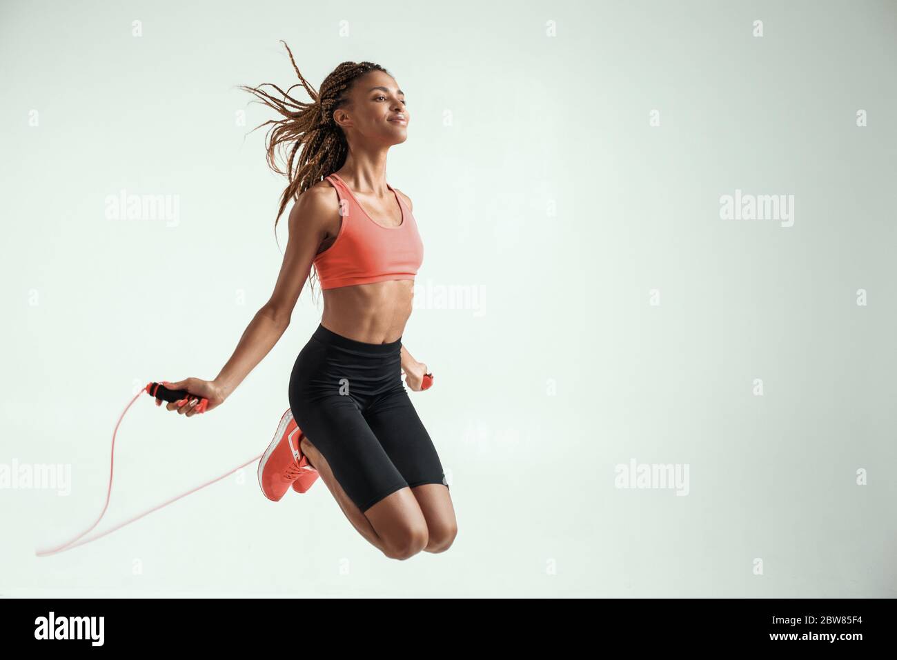 African american girl jumping rope hi-res stock photography and